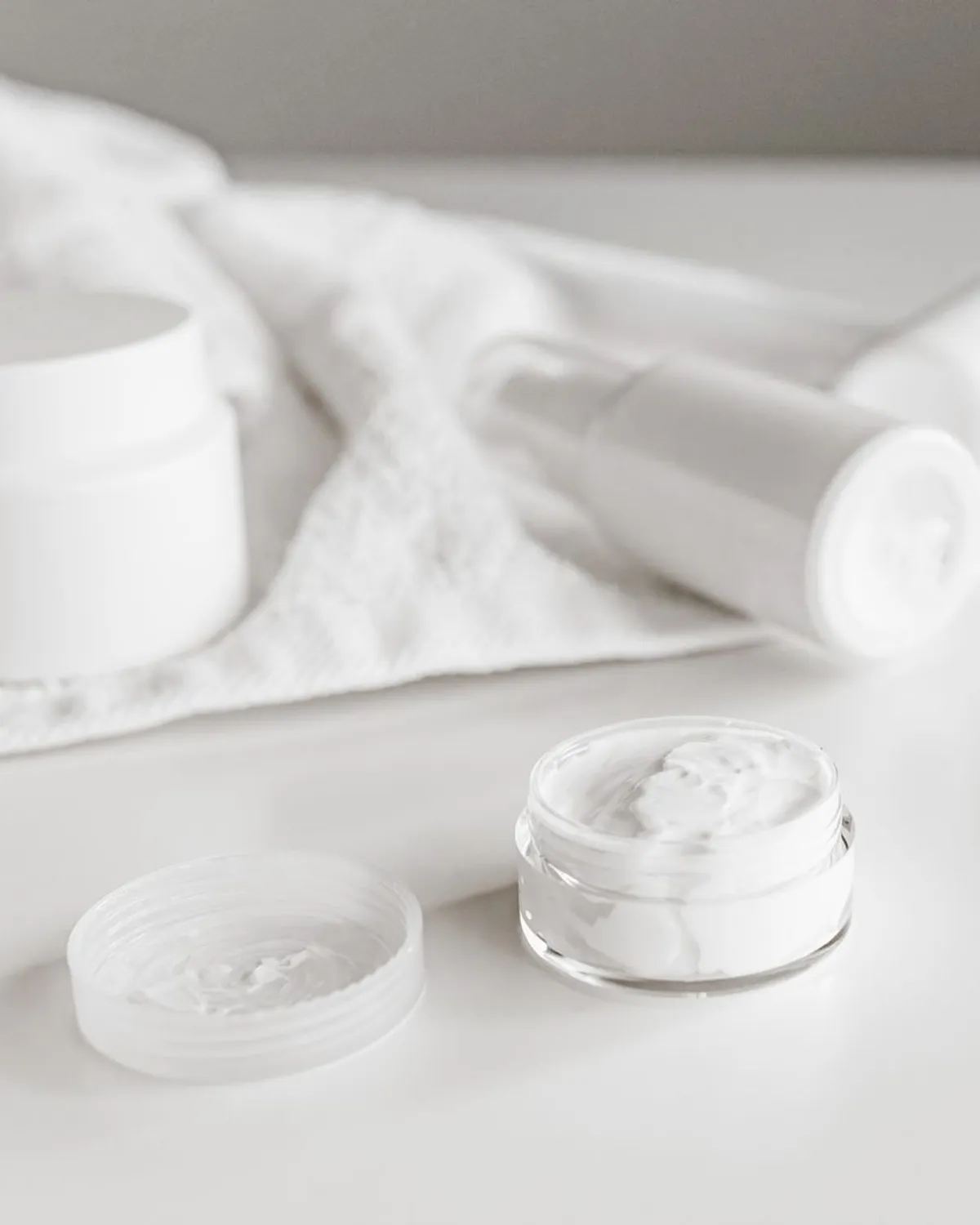 open jar of rich white moisturizing cream